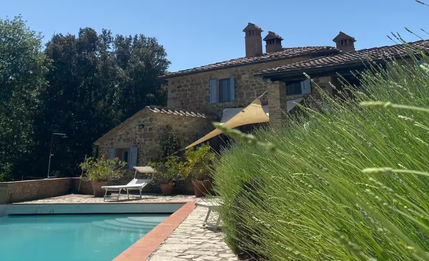 Tuscan villa with cypress trees for corporate retreat Italy